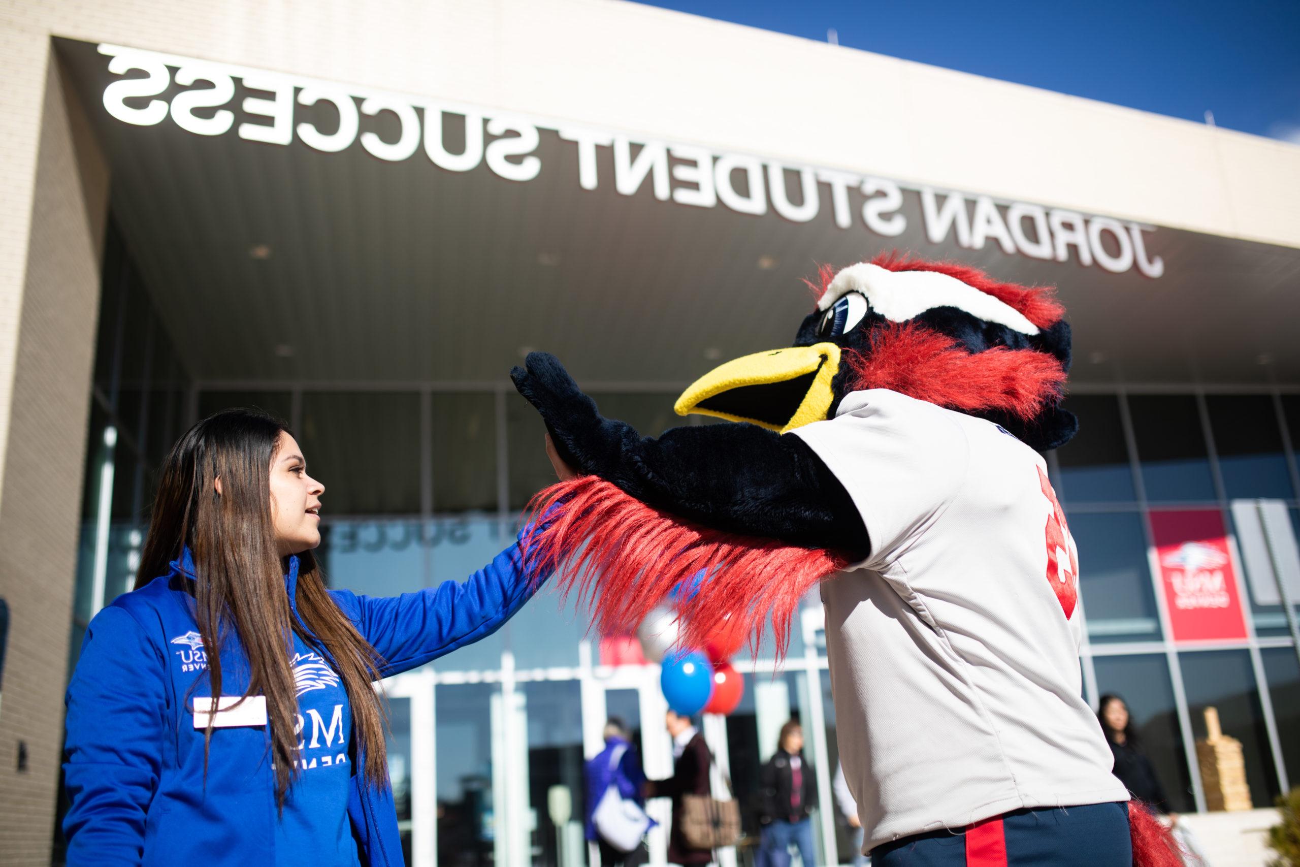 Rowdy highfive student